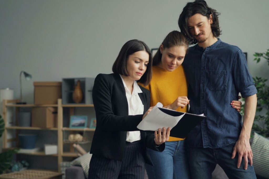 real estate agent explaining compliance when buying a house
