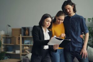 real estate agent explaining compliance when buying a house