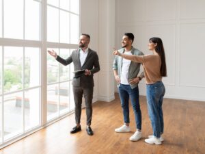 An Australian couple discussing the property market with a buyer’s agent.